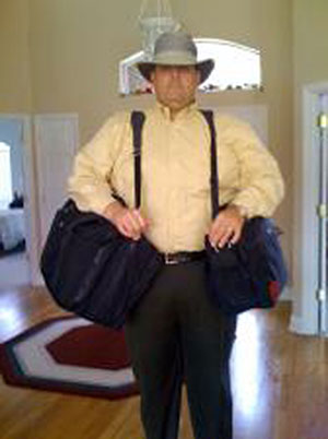 Missionary Who's Built Like an Oxx Yokes up with Two Carry-on Bags