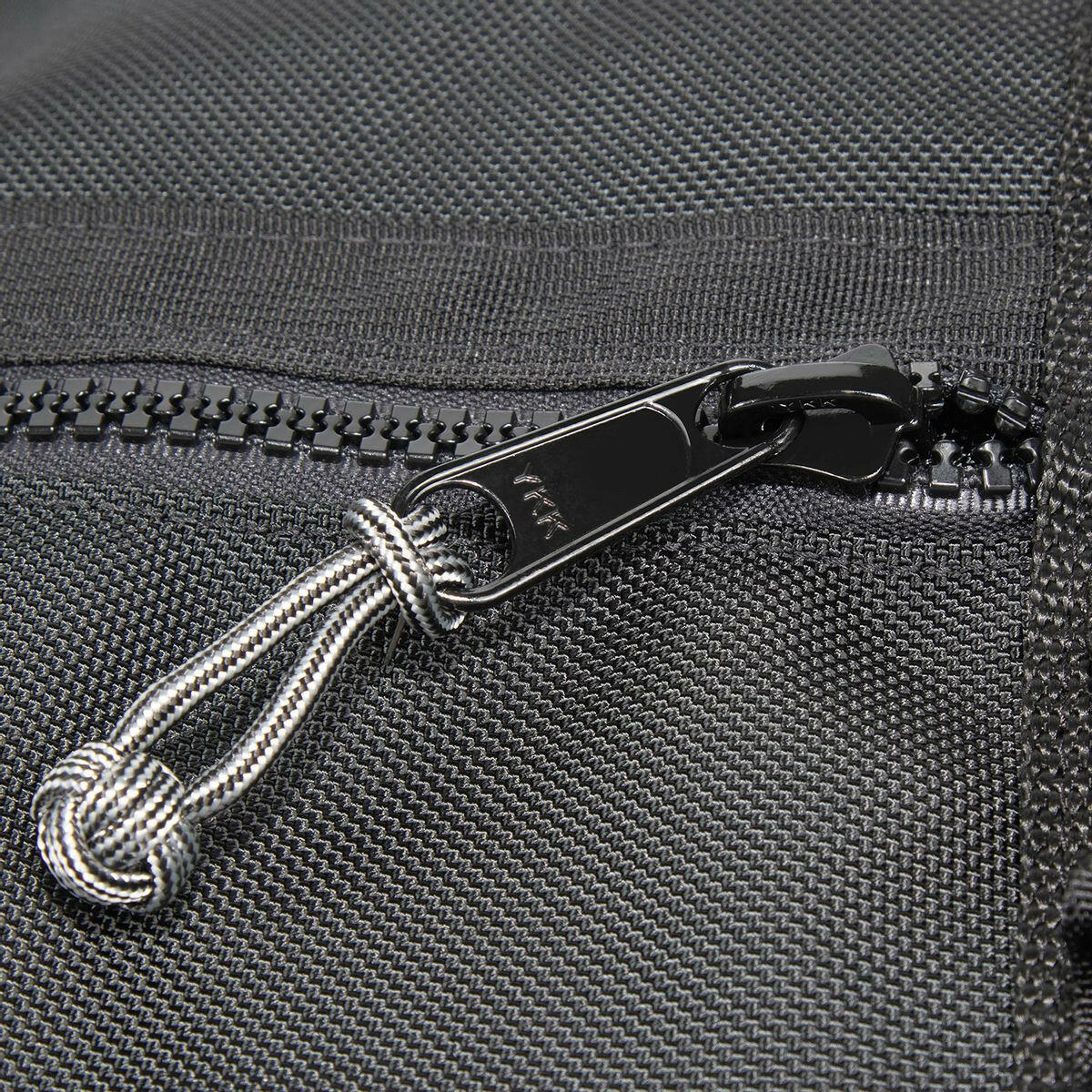 Railroad backpack rucksack. close up of YKK zipper slider with monkey fist zip knot attached