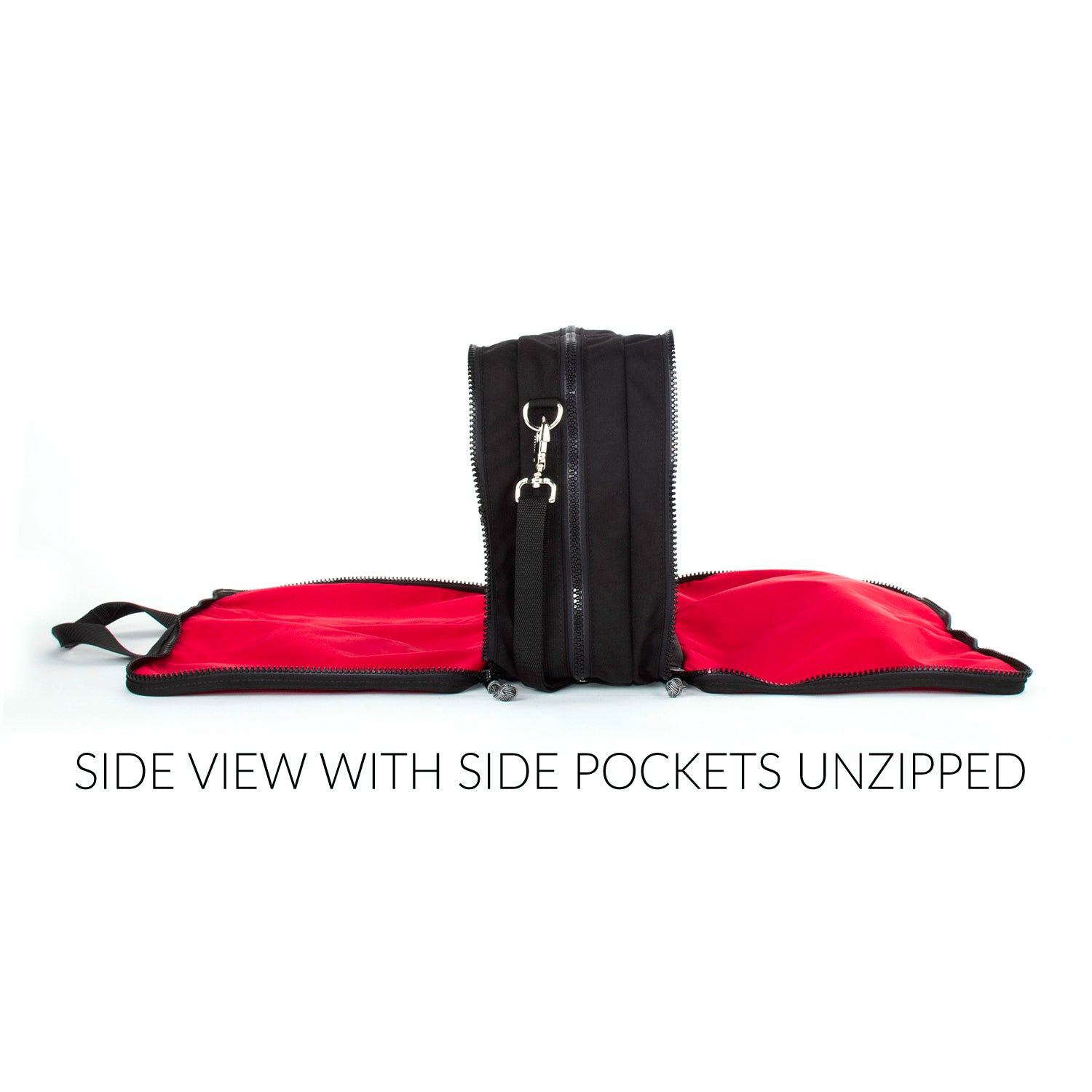 End view with both side pockets opened showing the red lining of the bag.