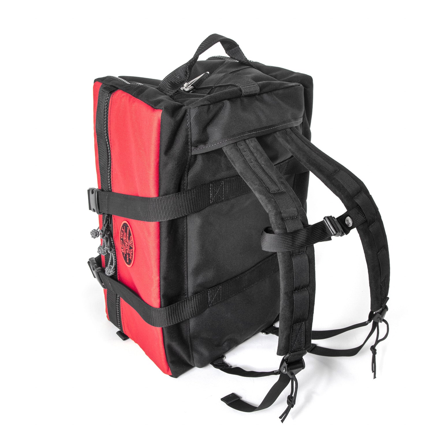 Small Red Hybrid Duffel with lifetime guarantee3/4 view of backpack straps deployed and chest strap or sternum strap . Made in America