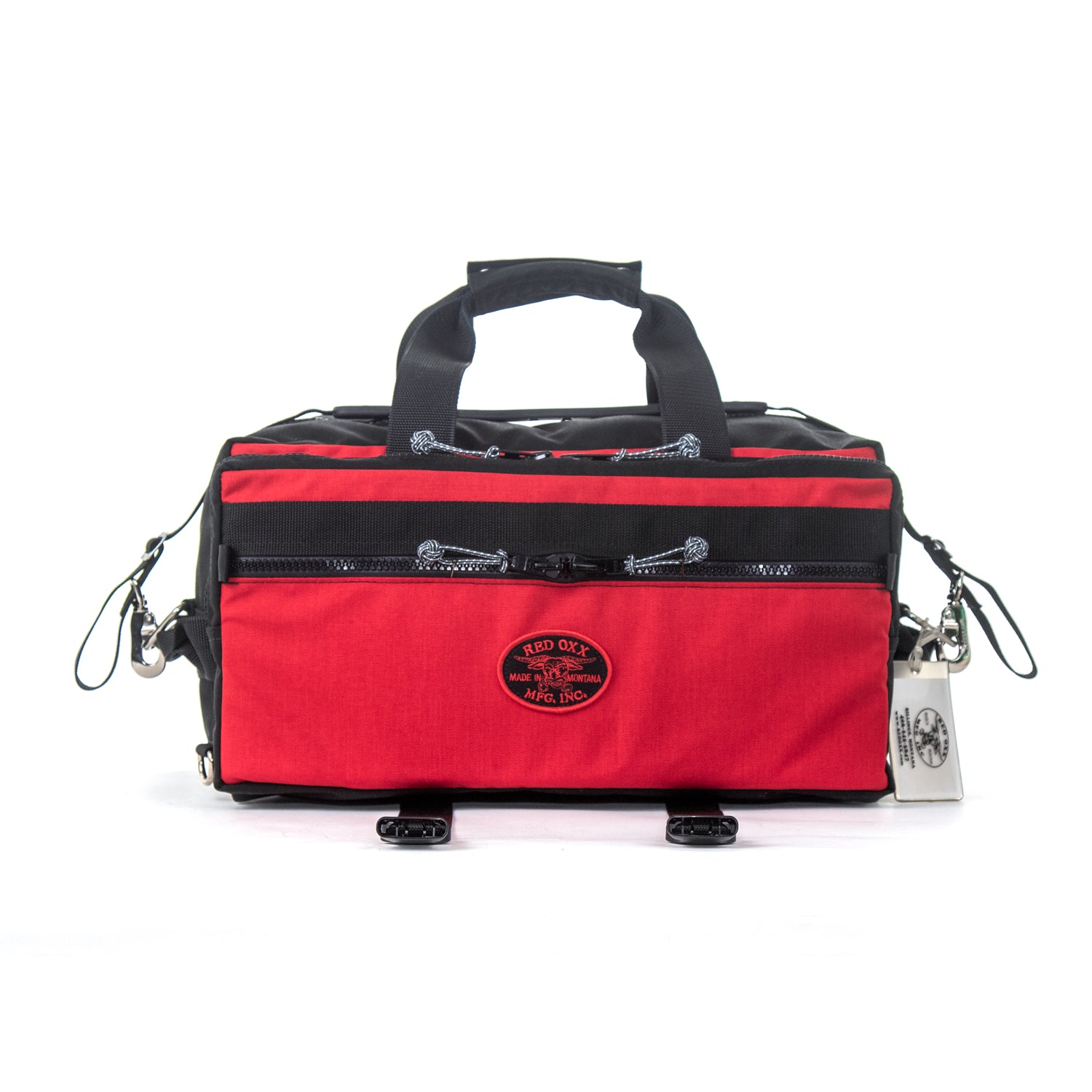 Lil Hombre hybrid small duffel in red - side view with compression straps open.