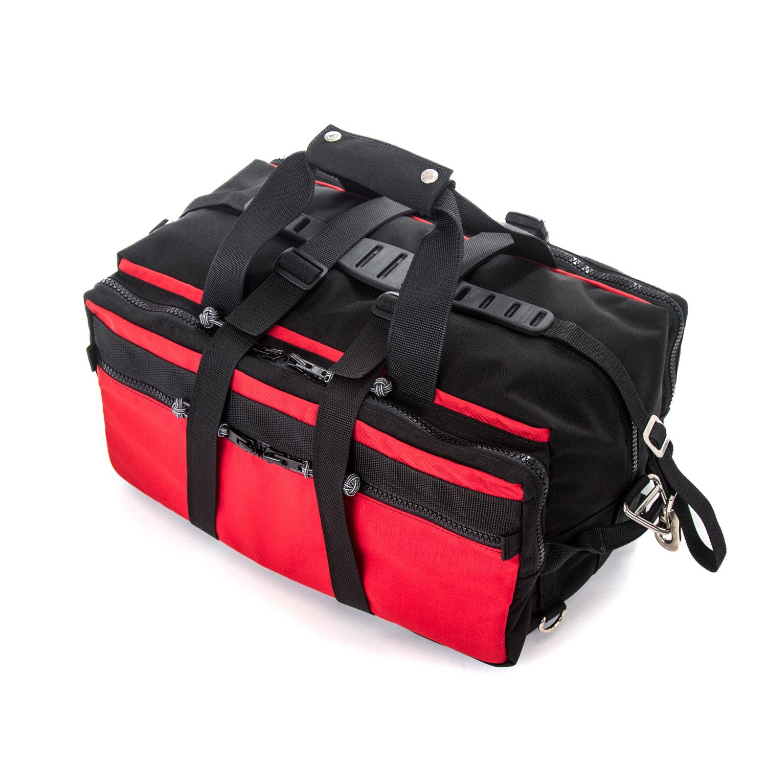 Small Rugged Duffel in Red. Made in America. Top view with compression straps , standard claw shoulder strap.
