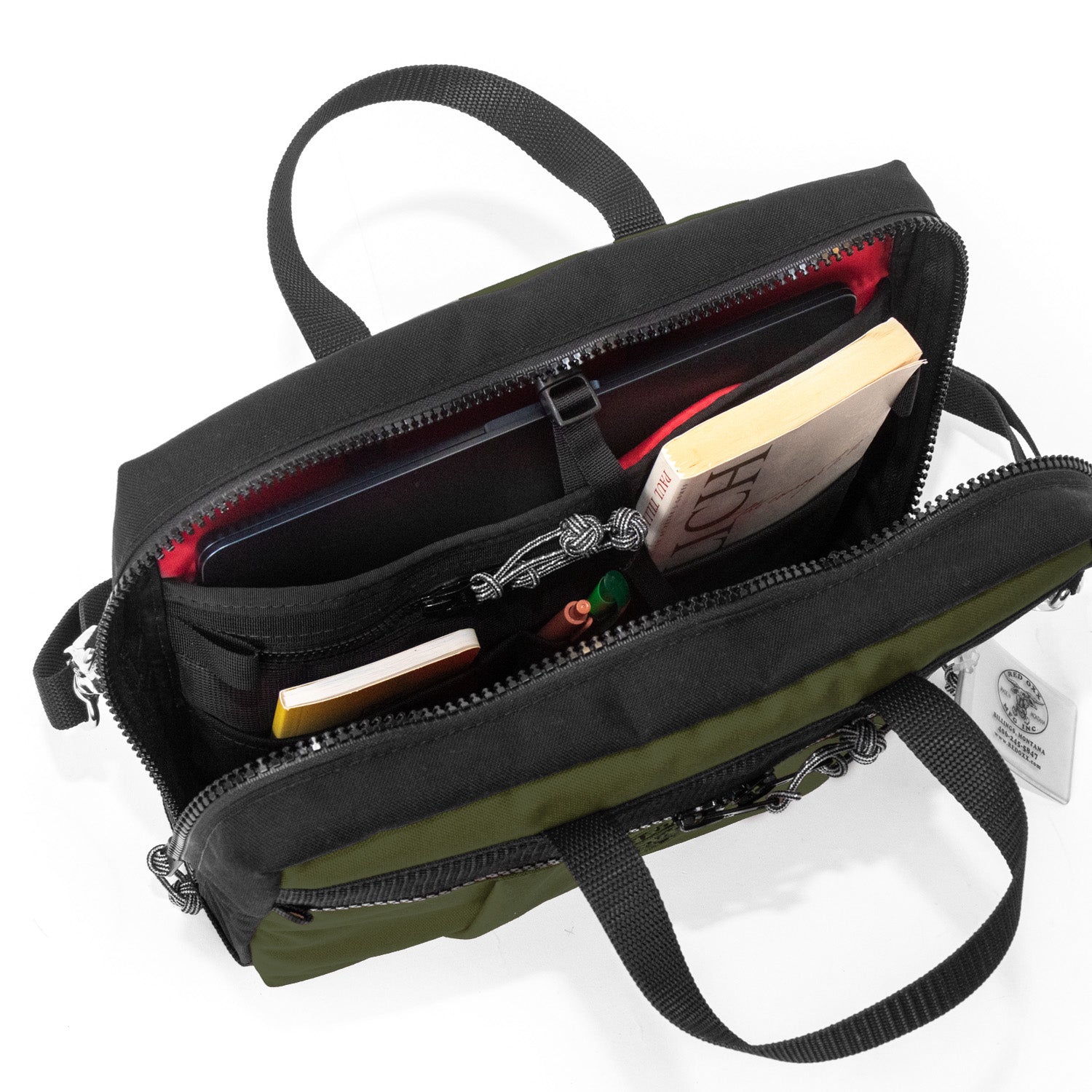 Micro Manager open view with book, notebook pens and laptop. Buy it once Tablet Briefcase