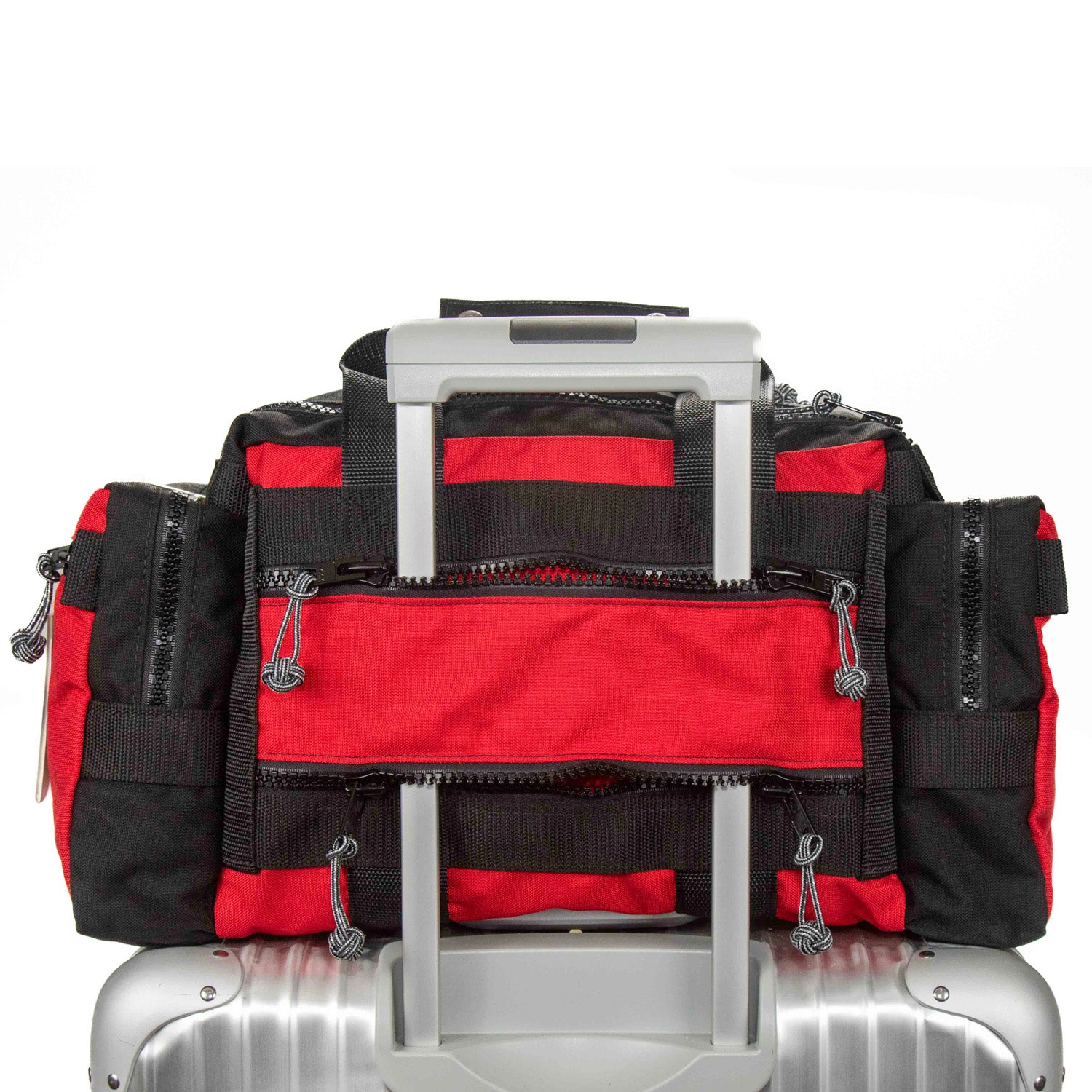 PR4 Safari Beano pass thru pocket makes mounting bag on rolling luggage secure. 