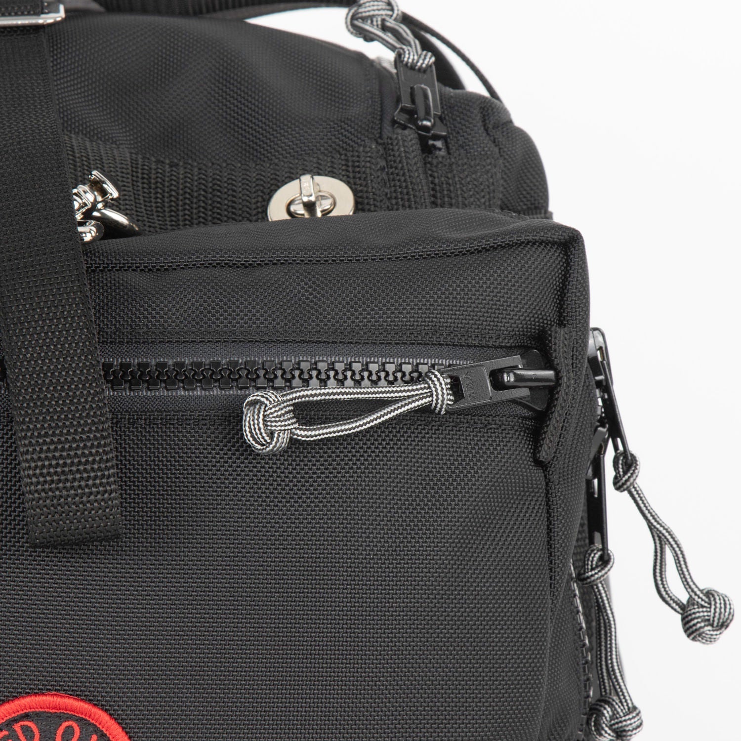 Slider tab detail with Monkeys Fist zip knot.