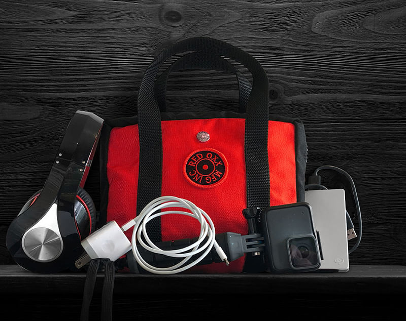 Red Oxx Lil Roy easily fits a nice compliment of digital accessories like headphones , charging cords , power block and Go Pro camera.  