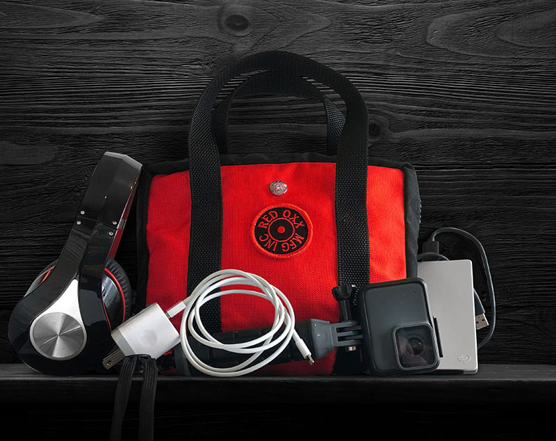 Red Oxx Lil Roy easily fits a nice compliment of digital accessories like headphones , charging cords , power block and Go Pro camera.