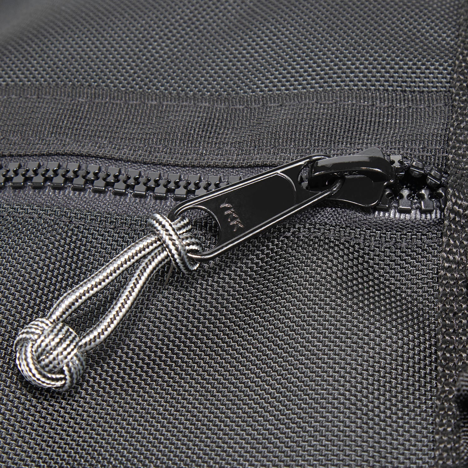 Zipper slider close up with Zip Knot. 