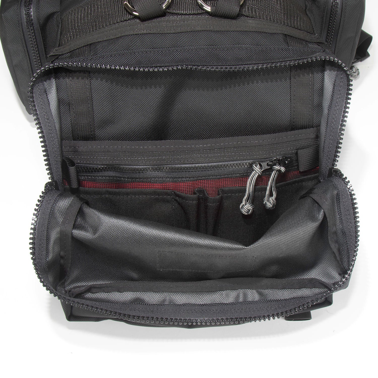 Inside view of outer pocket with mesh security pocket and pen and pencil holder slots. 