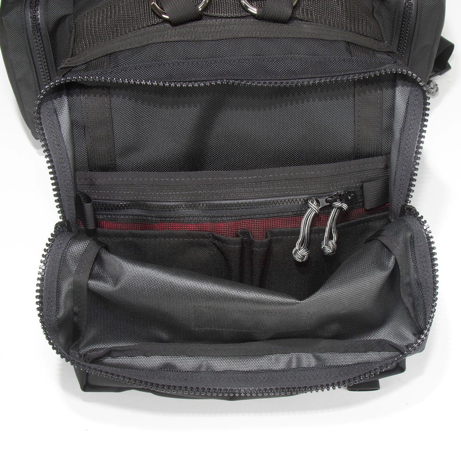 Inside view of outer pocket with mesh security pocket and pen and pencil holder slots.