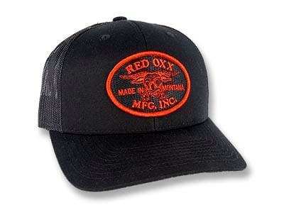 Red Oxx trucker hat patch logo, patch is red and black on black hat. 