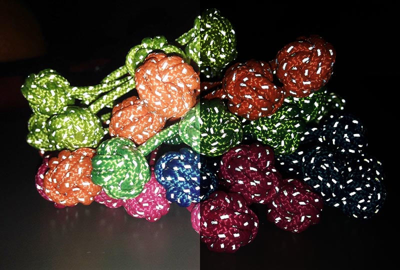 Low light demonstration of the reflective properties of the Monkeys Fist knots in various colors.