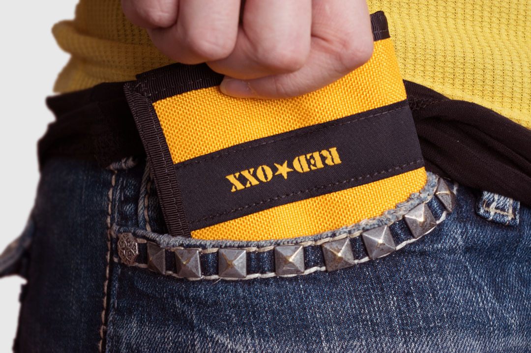Wallet fits into front pocket for security while traveling.