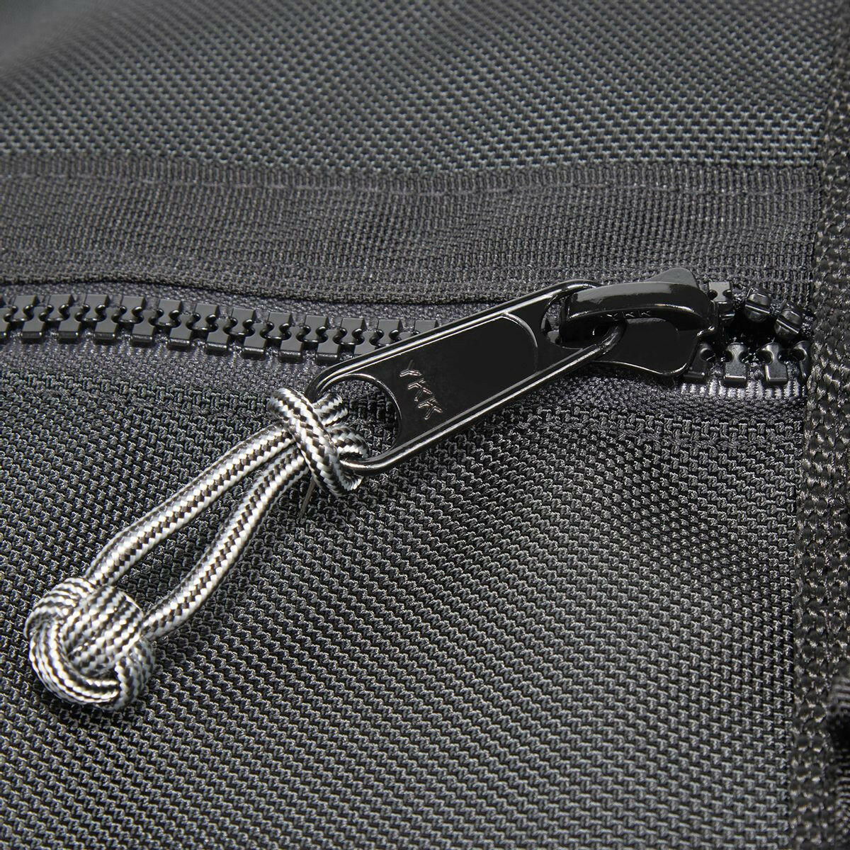 close up of YKK zipper slider with monkey fist zip knot attached