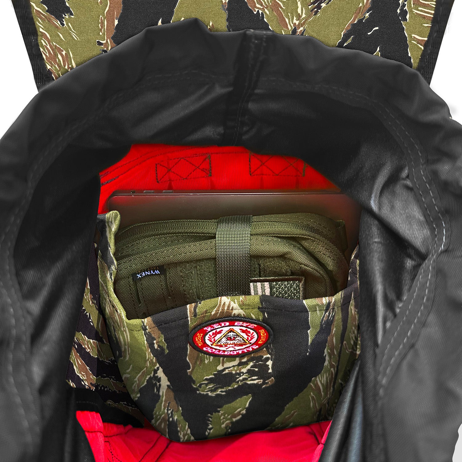 Camouflage bag with a visible brand logo inside on the pocket.