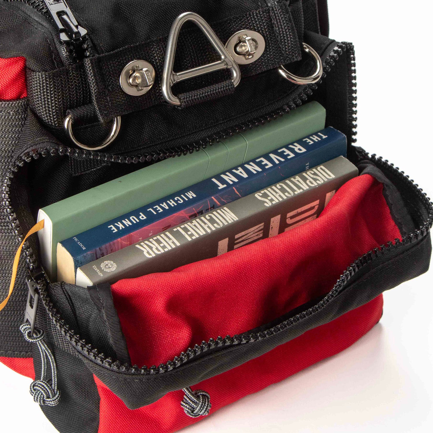 Paperback books in end pocket of PR4 Safari Beano bag. 