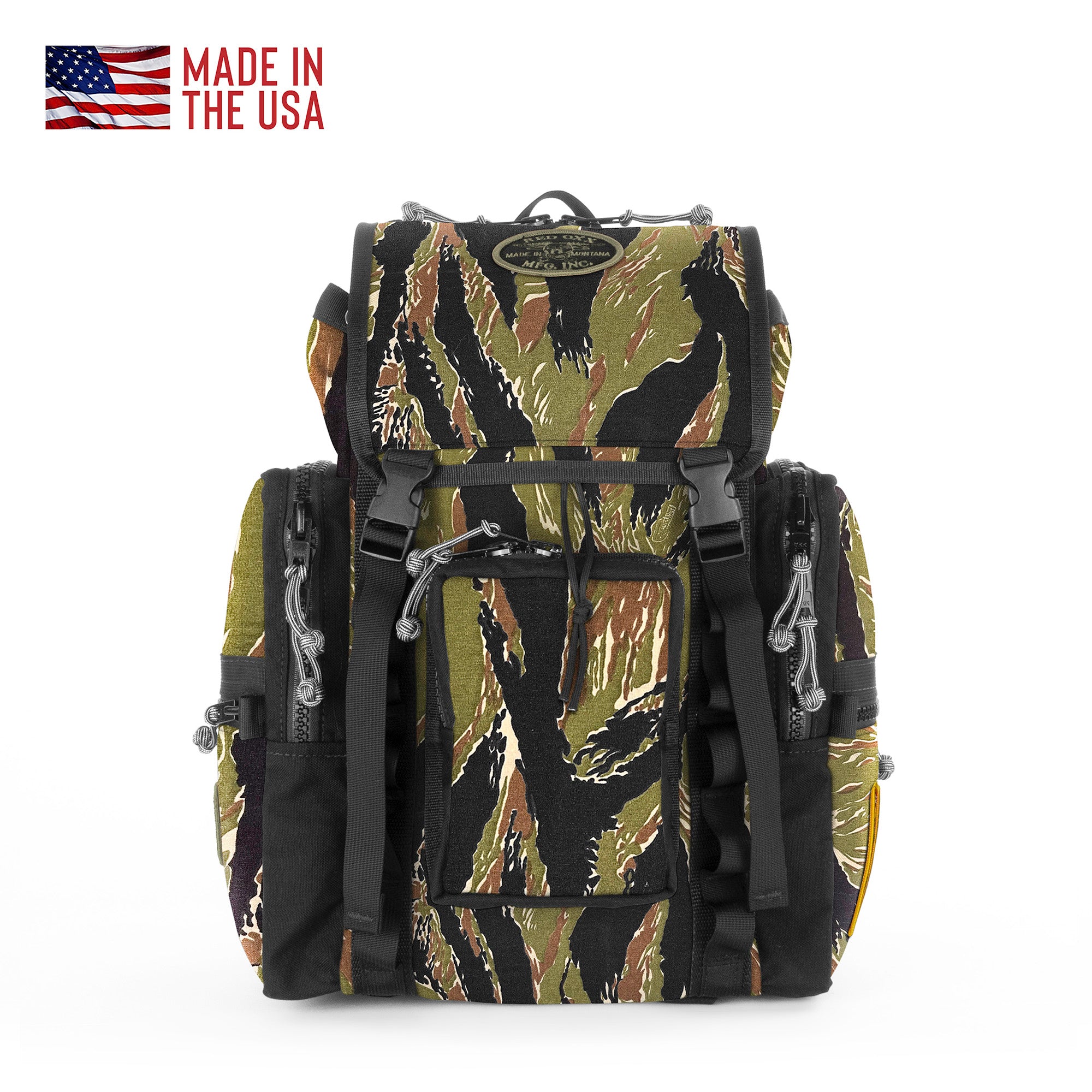 Camouflage backpack with 'Made in the USA' text and American flag on a white background