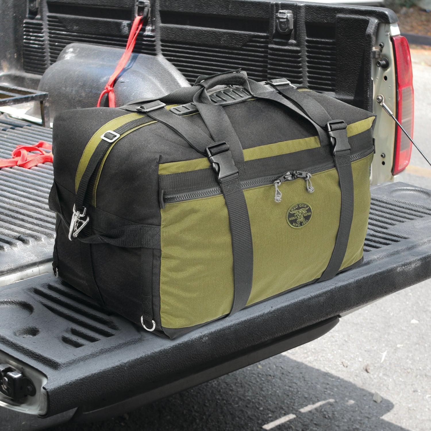 Sherpa Jr. Duffle in back of pickup truck. 