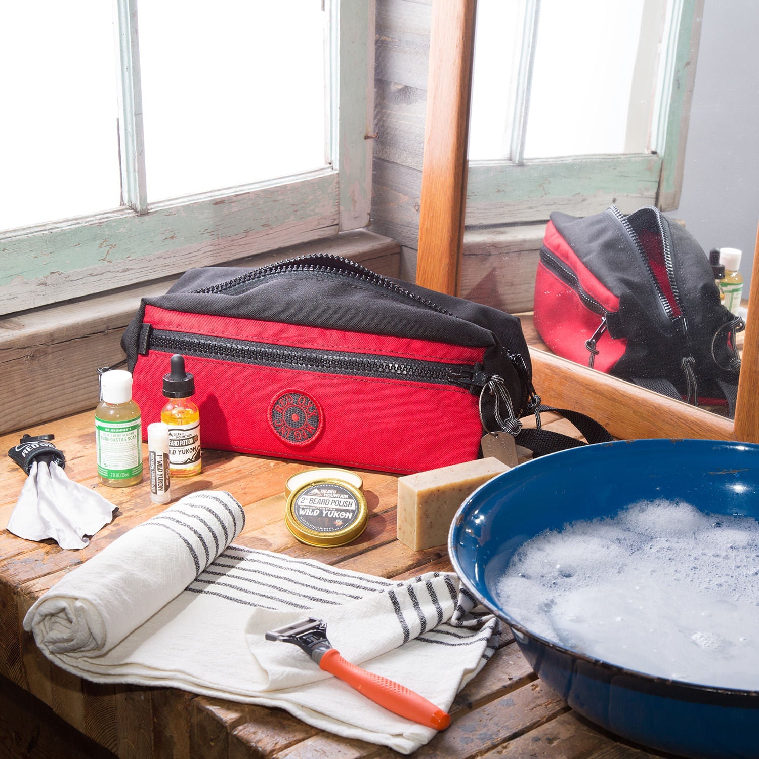 Nomad shave kit on counter with shaving accessories.